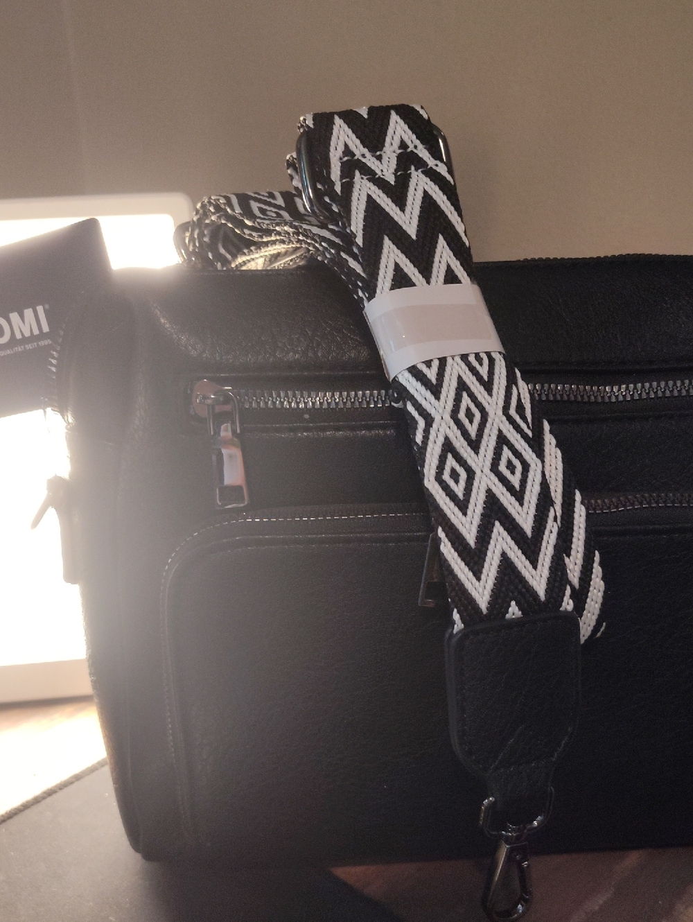 TAN . TOMI Black Crossbody Bag with Removable Black & White Geometric Strap